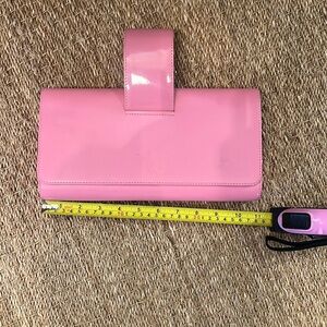 Pink Perrin clutch bag with pink patent wristlet. Suede lined interior